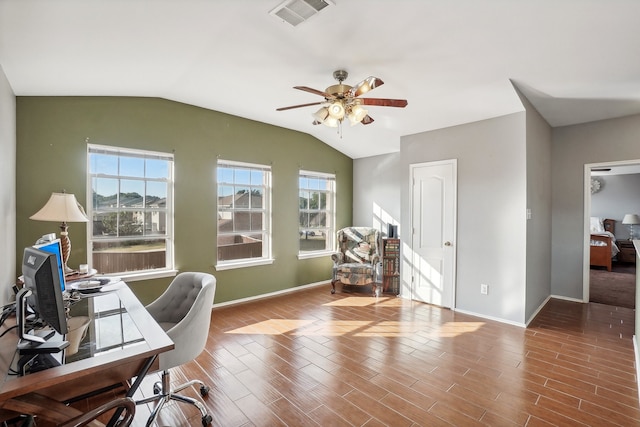 home office with lofted ceiling, hardwood / wood-style floors, and ceiling fan