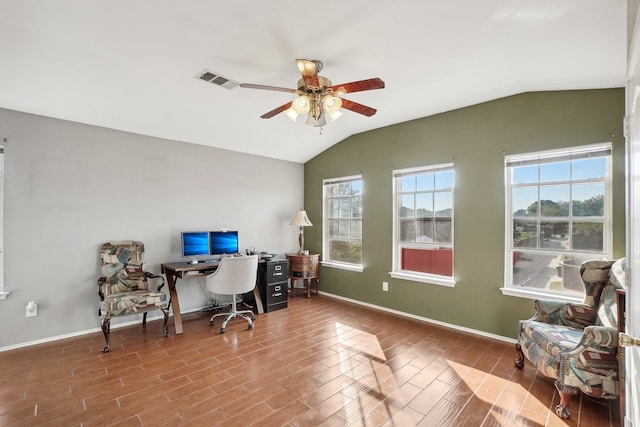 home office featuring lofted ceiling, hardwood / wood-style floors, and ceiling fan