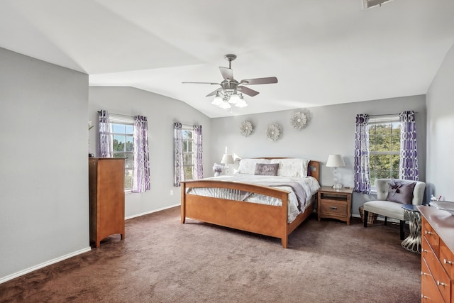 carpeted bedroom with vaulted ceiling, multiple windows, and ceiling fan