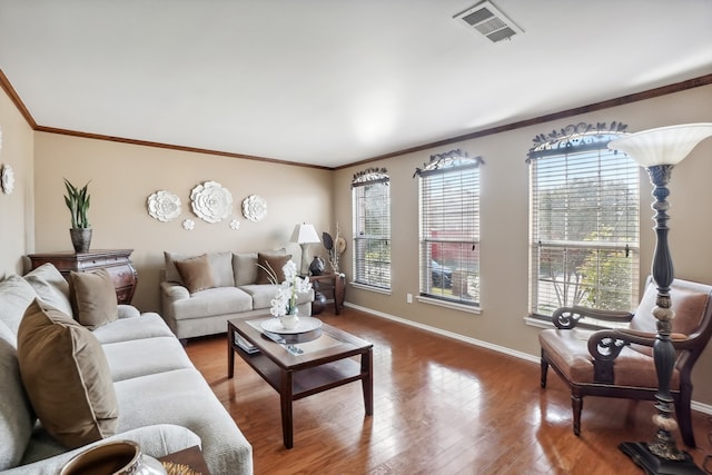 living room featuring crown molding and hardwood / wood-style floors