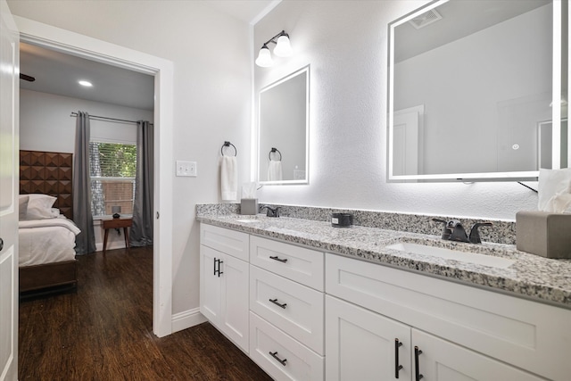 bathroom with vanity and hardwood / wood-style floors