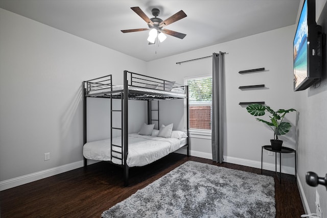 bedroom featuring dark hardwood / wood-style floors and ceiling fan