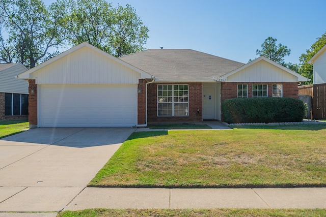 ranch-style house featuring a front lawn and a garage