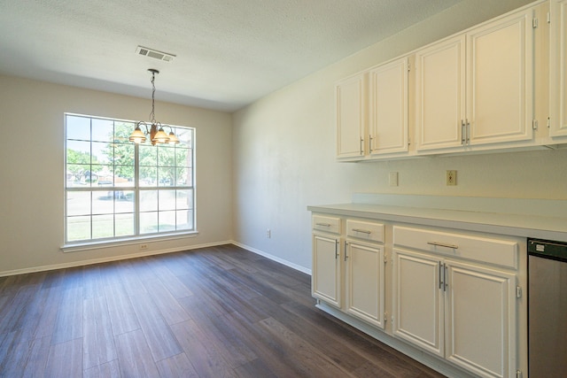 kitchen with stainless steel dishwasher, white cabinets, hanging light fixtures, and dark hardwood / wood-style floors