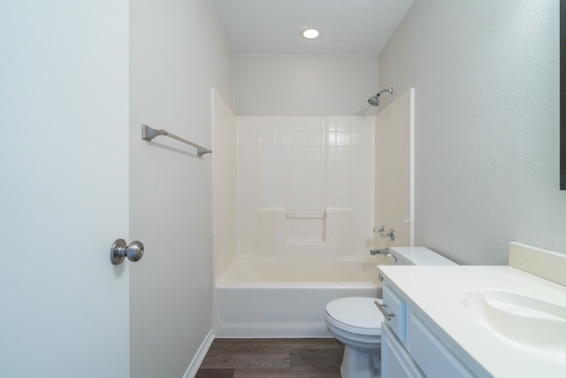 full bathroom with vanity, hardwood / wood-style flooring, toilet, and tub / shower combination