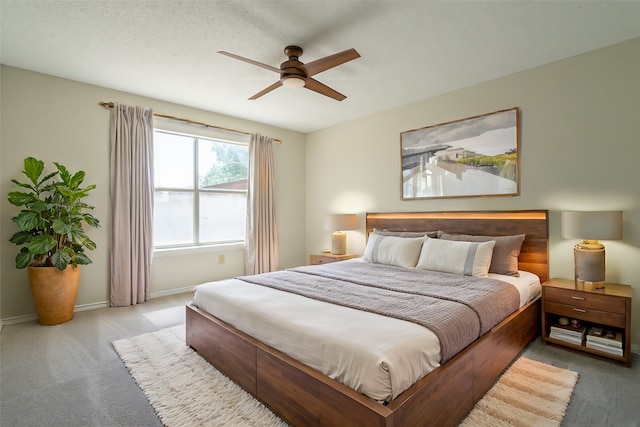 bedroom with light carpet and ceiling fan