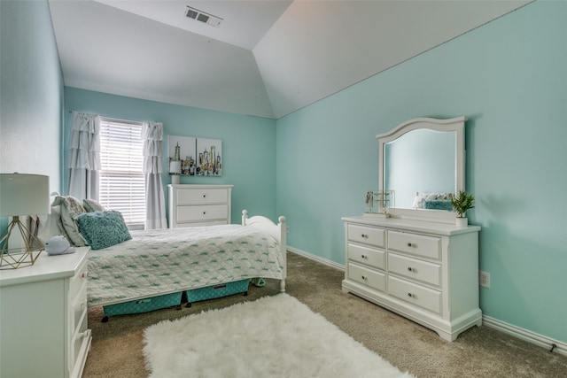 carpeted bedroom featuring vaulted ceiling