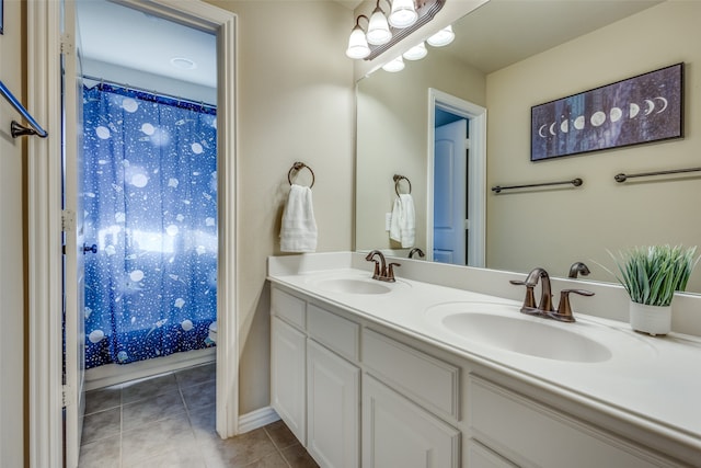 bathroom with vanity, toilet, curtained shower, and tile patterned flooring