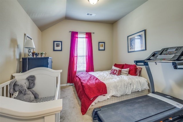 bedroom featuring vaulted ceiling and light colored carpet