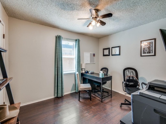 home office with a ceiling fan, a textured ceiling, dark wood-style flooring, and baseboards