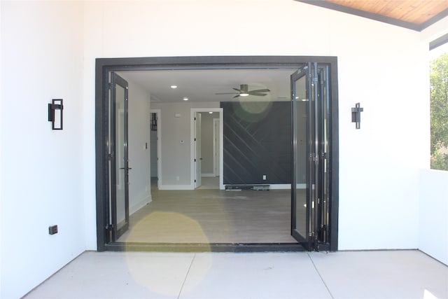 entrance to property with ceiling fan