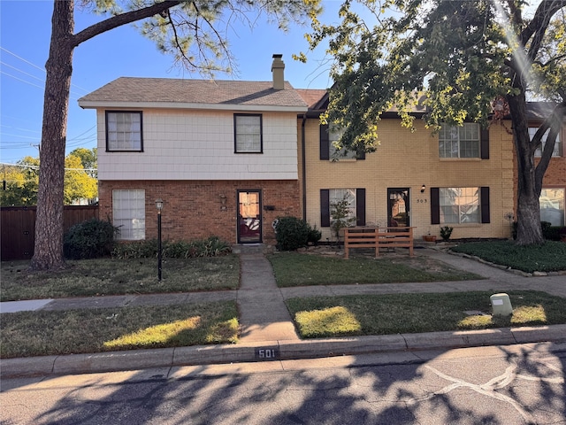 view of front facade with a front lawn