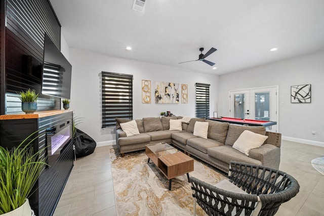 living room featuring ceiling fan, billiards, and french doors