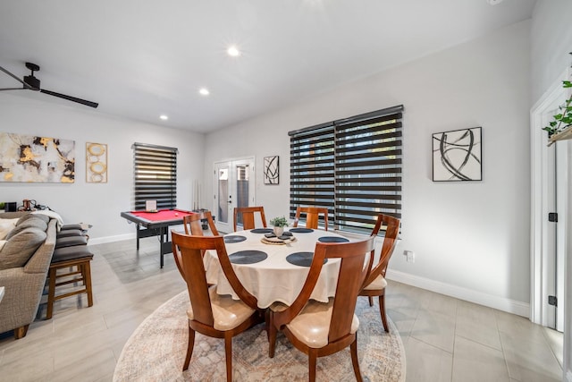 tiled dining area with ceiling fan