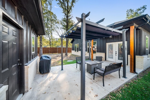 view of patio featuring french doors, an outdoor hangout area, and area for grilling