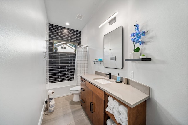 full bathroom featuring tile patterned flooring, shower / tub combo with curtain, vanity, and toilet