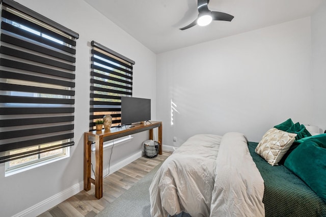 bedroom featuring light wood-type flooring and ceiling fan