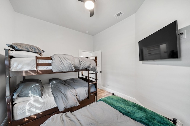 bedroom featuring hardwood / wood-style flooring and ceiling fan