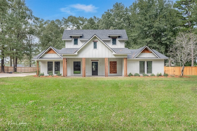 251 Jessie Jones Dr, Benton, LA 71006 - modern farmhouse style home featuring roof with shingles, fence, and a front yard