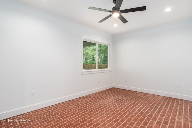 unfurnished room with ceiling fan and ornamental molding