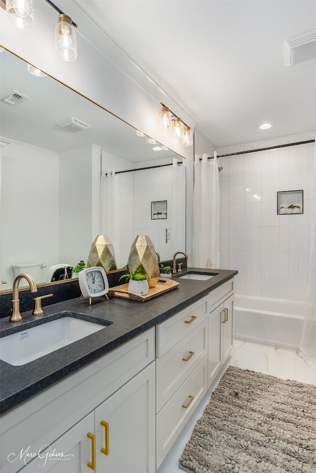 251 Jessie Jones Dr, Benton, LA 71006 - bathroom featuring double vanity, visible vents, shower / bath combo, and a sink