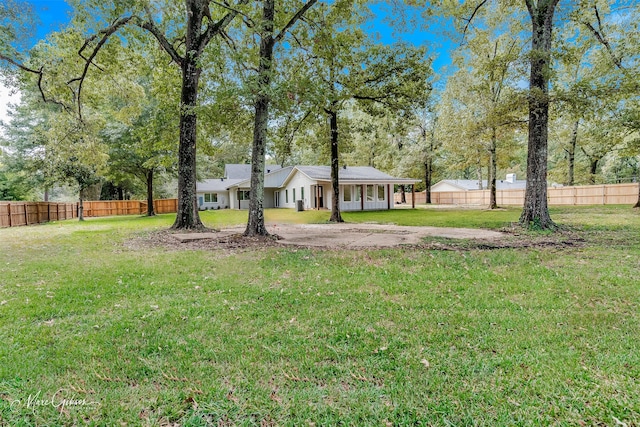 251 Jessie Jones Dr, Benton, LA 71006 - view of front facade featuring a front yard and fence