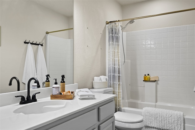 full bathroom featuring shower / bathtub combination with curtain, toilet, and vanity