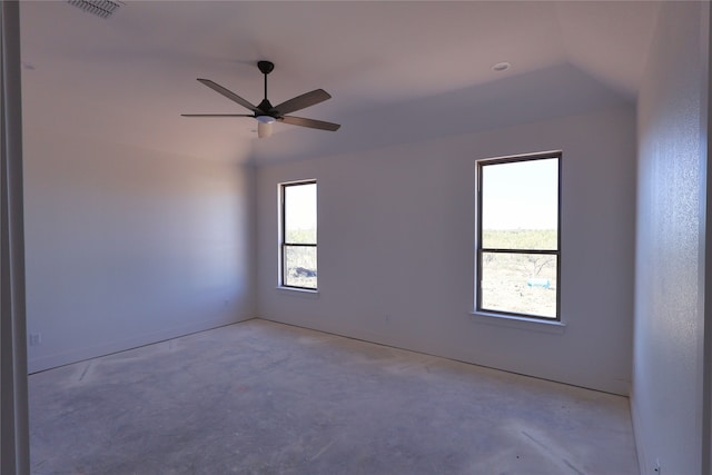 unfurnished room with ceiling fan and plenty of natural light