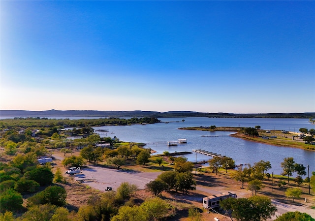 aerial view at dusk with a water view