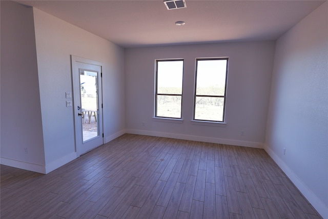 unfurnished room featuring light wood-type flooring