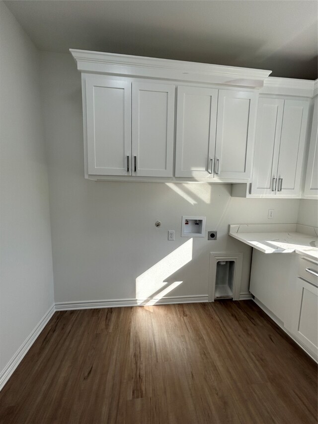 laundry area with hookup for an electric dryer, washer hookup, cabinets, gas dryer hookup, and dark wood-type flooring