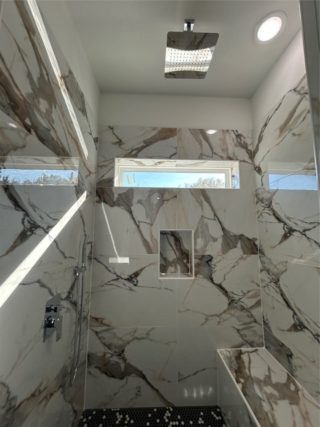 bathroom featuring tiled shower