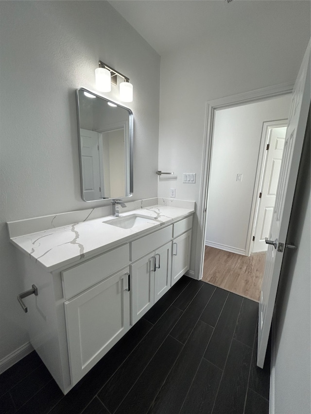 bathroom with wood-type flooring and vanity