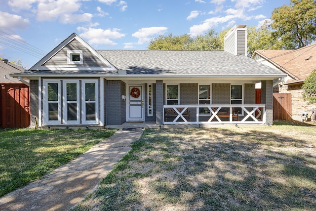 ranch-style home featuring a front yard