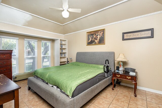 tiled bedroom featuring ceiling fan