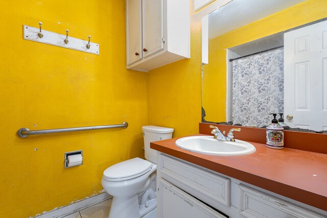 bathroom featuring vanity and toilet