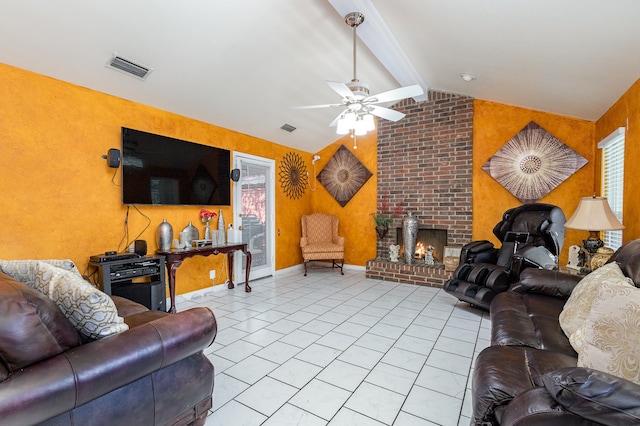 tiled living room featuring lofted ceiling with beams, a brick fireplace, and ceiling fan