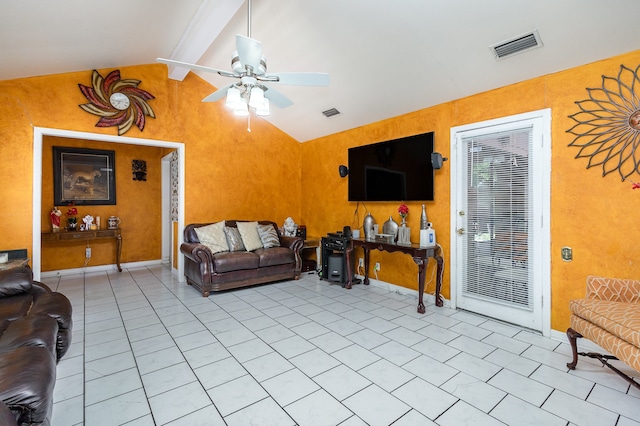 living room featuring vaulted ceiling with beams, light tile patterned flooring, and ceiling fan