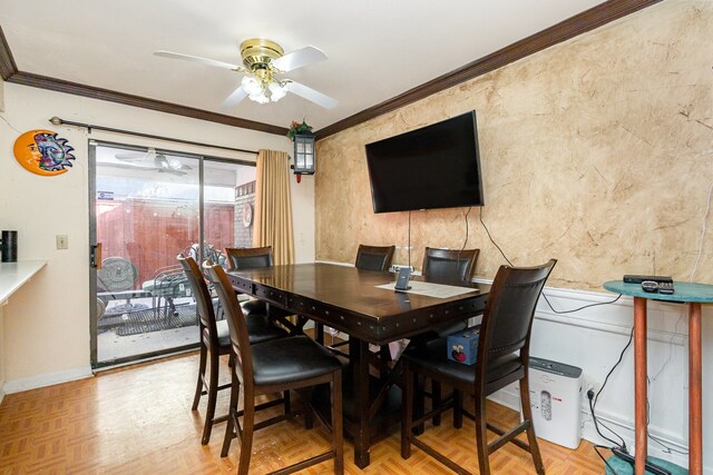 dining area featuring crown molding, parquet floors, and ceiling fan