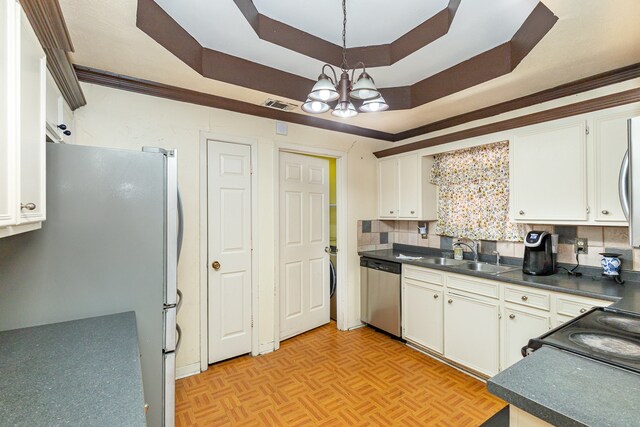 kitchen featuring sink, appliances with stainless steel finishes, white cabinetry, and tasteful backsplash