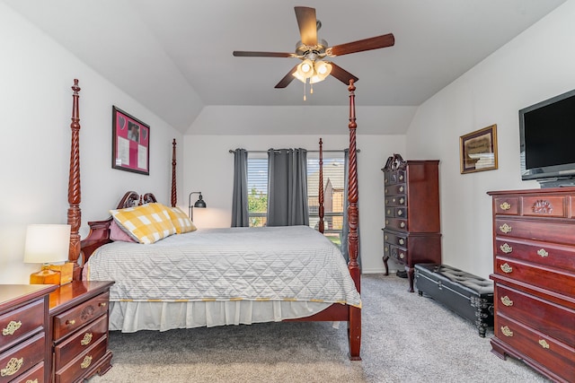 carpeted bedroom with vaulted ceiling and ceiling fan