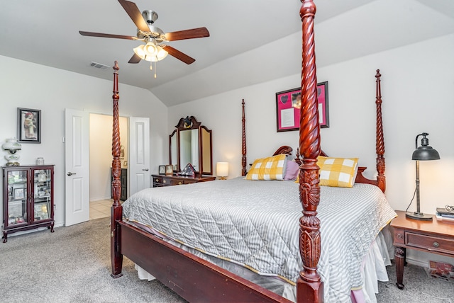 bedroom with ceiling fan, lofted ceiling, and light carpet