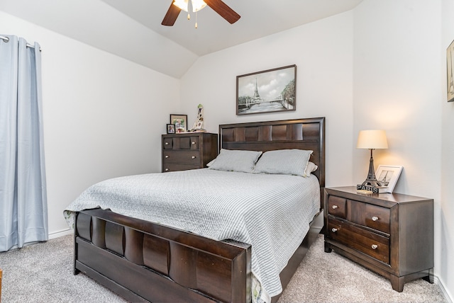 carpeted bedroom featuring lofted ceiling and ceiling fan