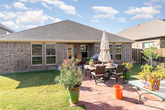 exterior space featuring a patio and a lawn