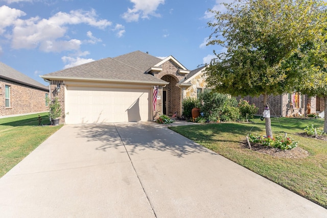 view of front facade featuring a garage and a front lawn