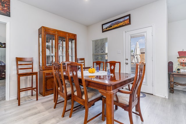 dining space featuring light hardwood / wood-style flooring