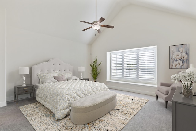 bedroom with ceiling fan, high vaulted ceiling, and carpet floors