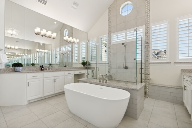 bathroom featuring vanity, separate shower and tub, high vaulted ceiling, and tile patterned flooring