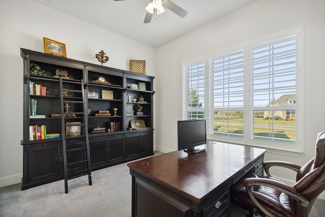 carpeted office with ceiling fan and vaulted ceiling