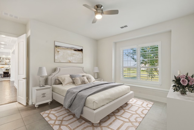 bedroom with tile patterned flooring and ceiling fan